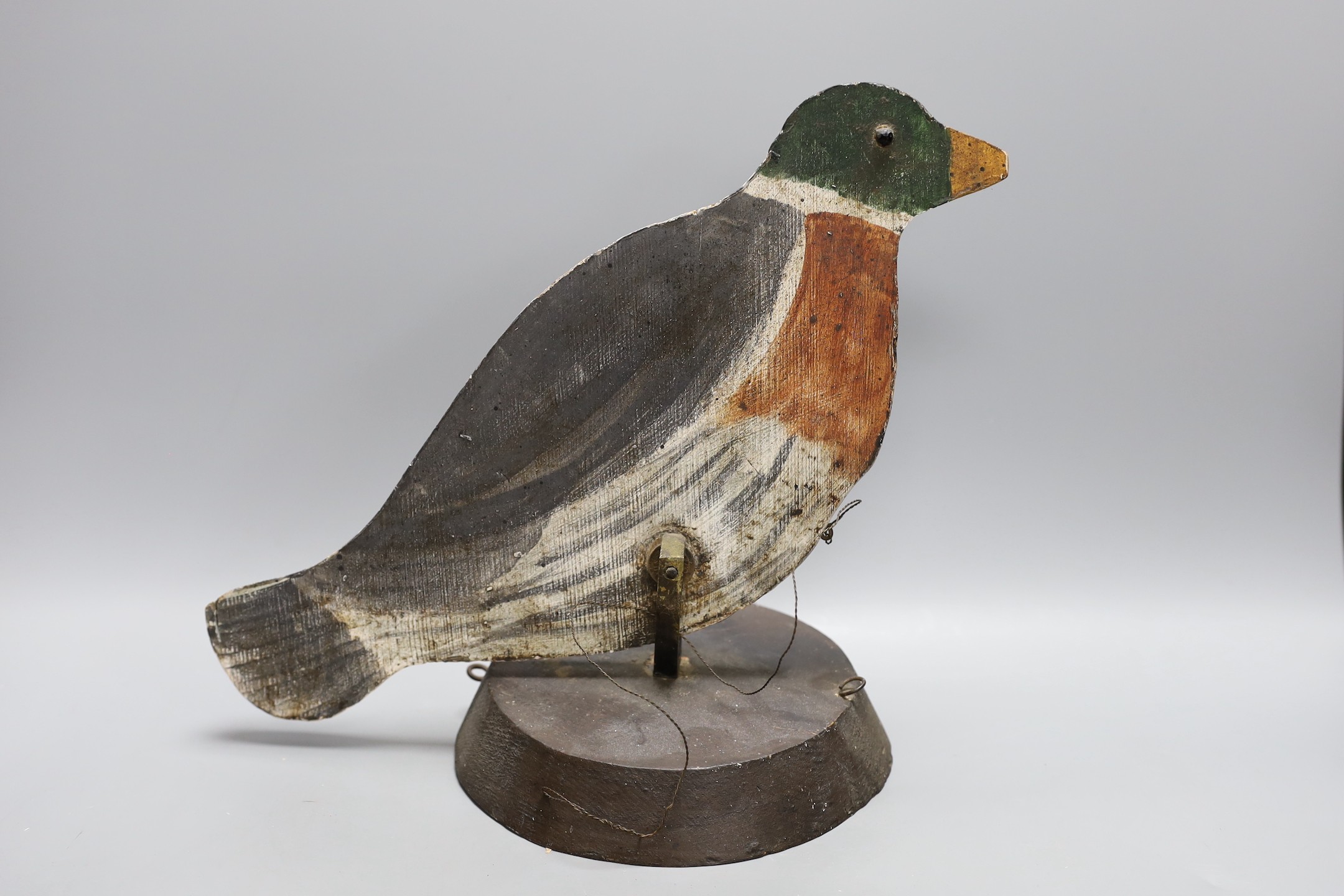 A painted wood pecking decoy bird, 31 cms high